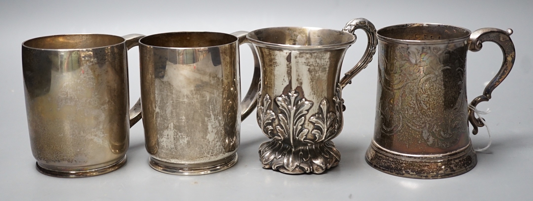 Four assorted silver mugs, including engraved George III, London, 1769, 94mm and a pair by Wakely & Wheeler, London, 1948/9, 26.1oz.